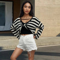 Striped long-sleeved sweater showing front and back wearable design with exposed navel detail