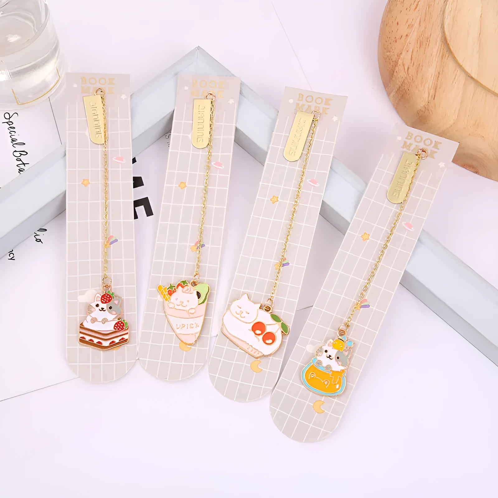 Jane Key Foodie Cute Pet Cat metal bookmark with cartoon pendant, shown in various colour designs.