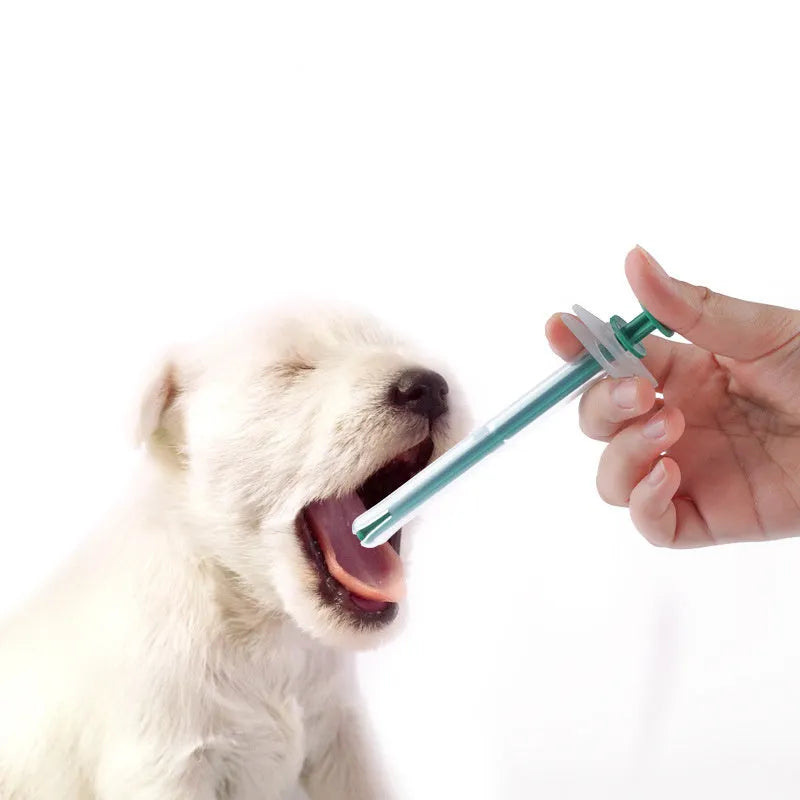 Two pet pill shooter guns with soft silicone tips for administering tablets to cats and dogs