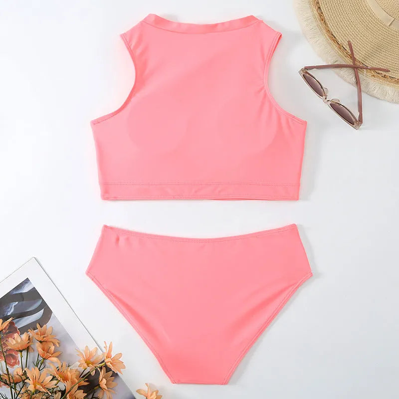 Pink high waist bikini swimsuit with side splits and briefs style on a mannequin