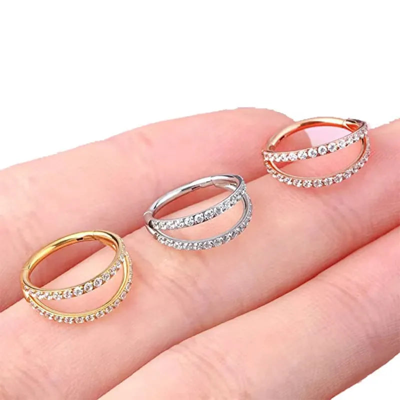G23 titanium alloy lip and nose ring piercing jewellery in gold or steel colour, showing puncture-style design.