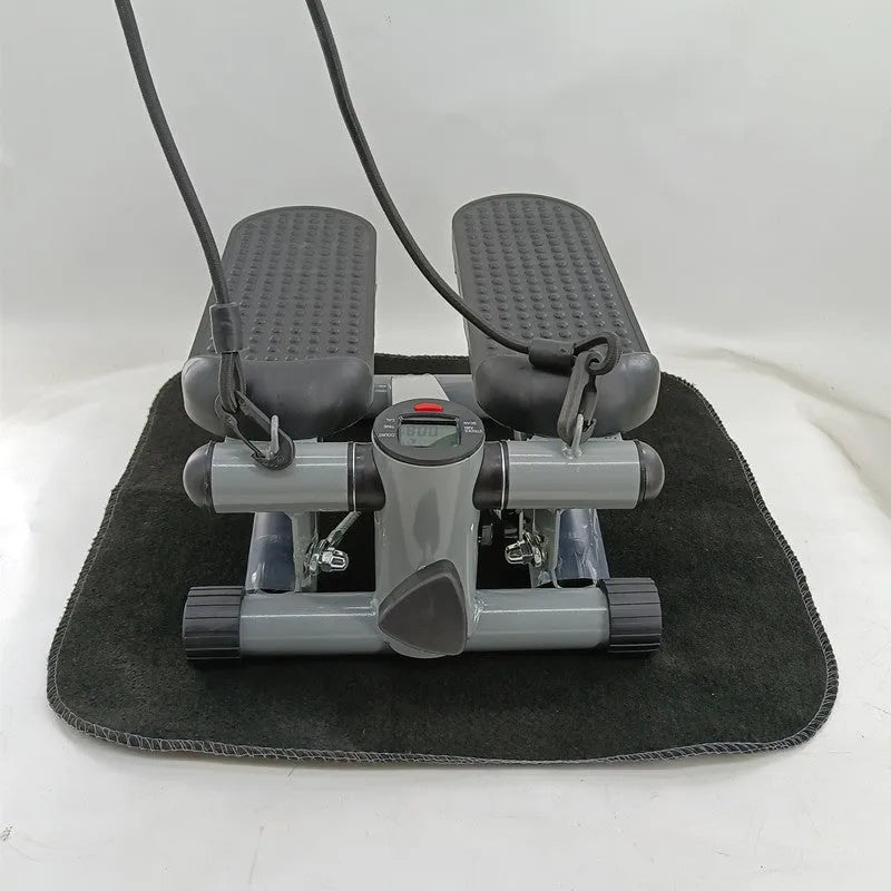 Silver grey hydraulic resistance mini treadmill and pedal machine for home gym waist slimming workouts.