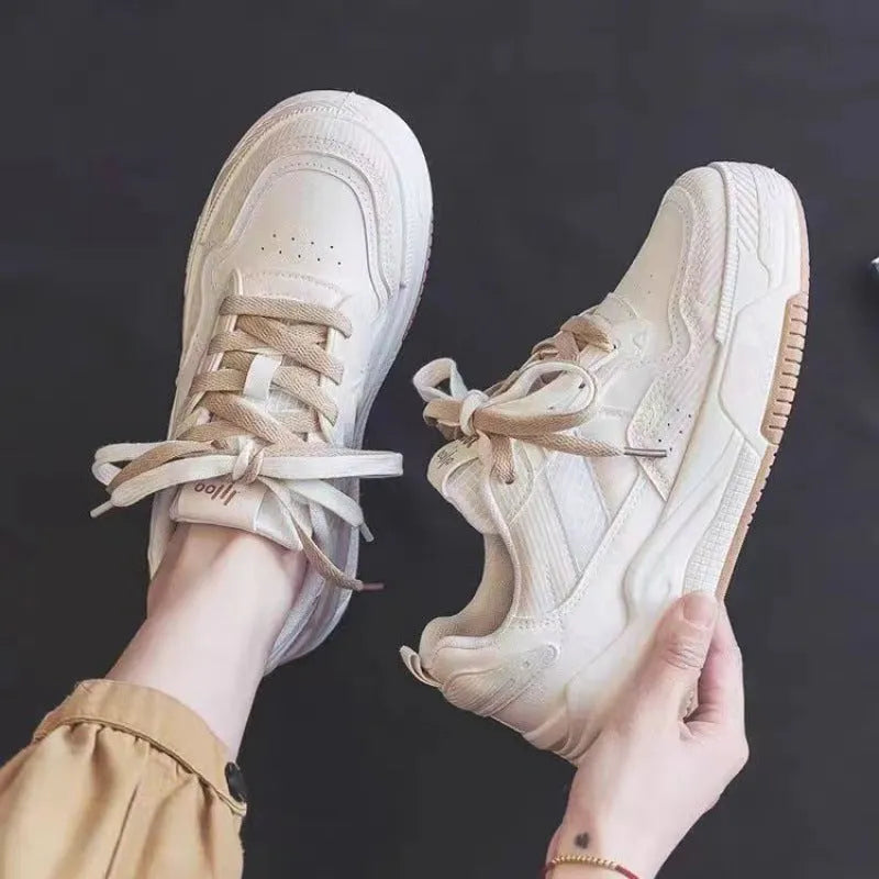 Low top sneakers with rubber sole in pink, milky white, and beige colours