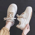 Low top sneakers with rubber sole in pink, milky white, and beige colours