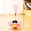 Pink cat stick toy with self-righting tumbler turntable measuring 17cm by 10cm