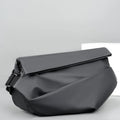 Grey PU crossbody bag showing shoulder strap and internal phone compartment