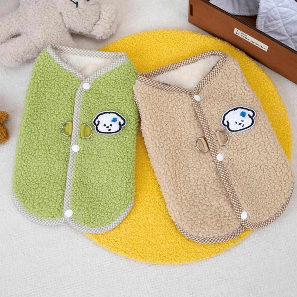 Green coral fleece dog vest with leash ring on small dog during autumn