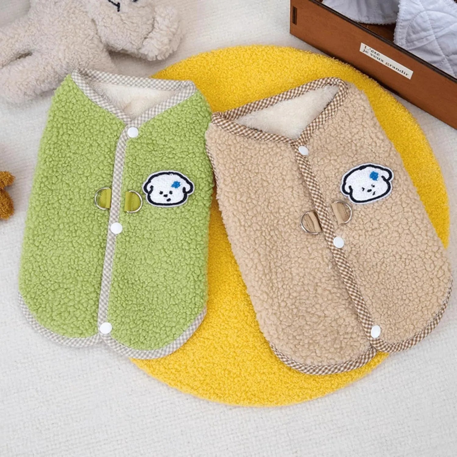 Green coral fleece dog vest with leash ring on small dog during autumn
