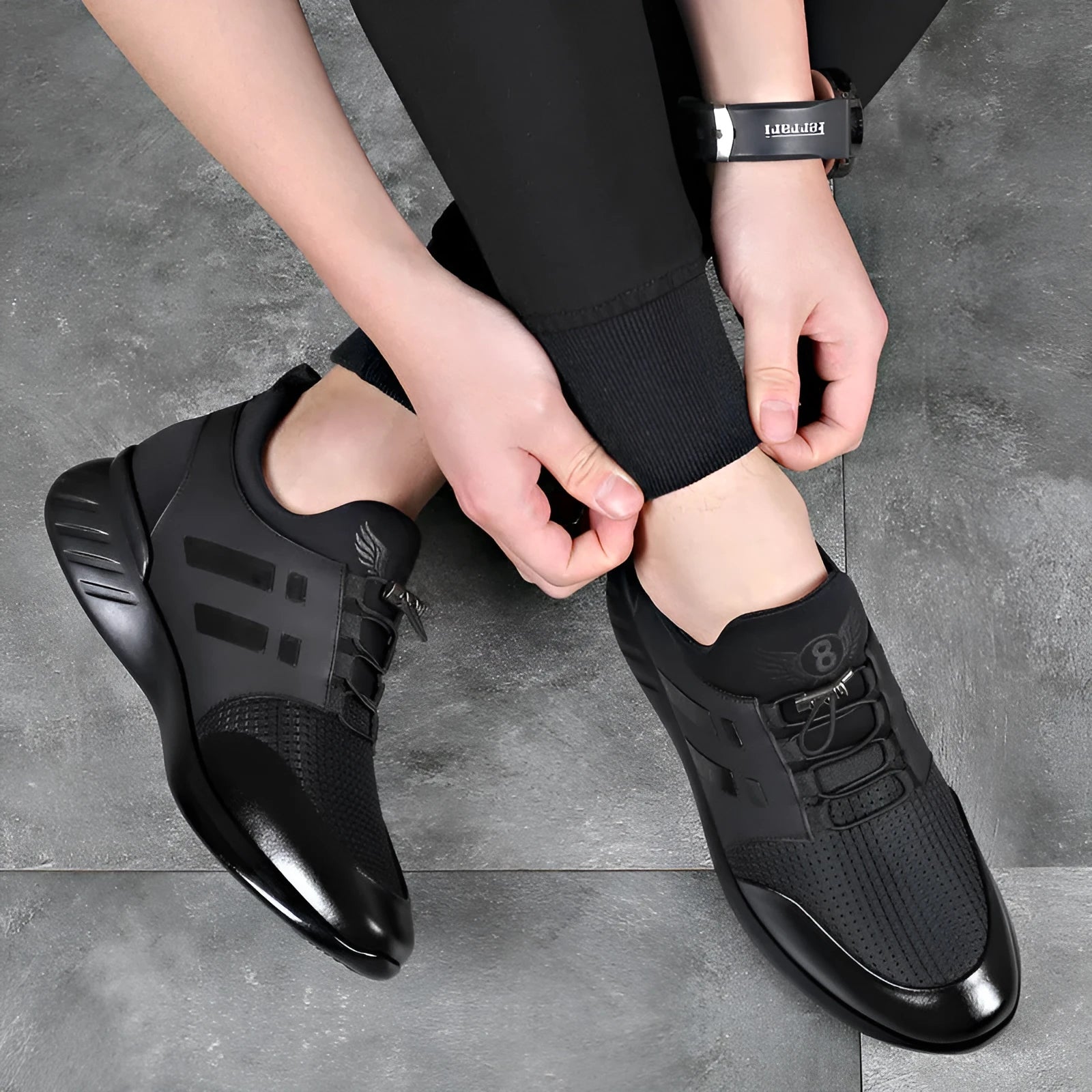 Men's black height increasing casual sneakers with chunky rubber sole and low top design.