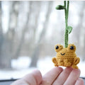 Green handmade woven plush frog car pendant hanging, showing 15cm length and cartoon style.