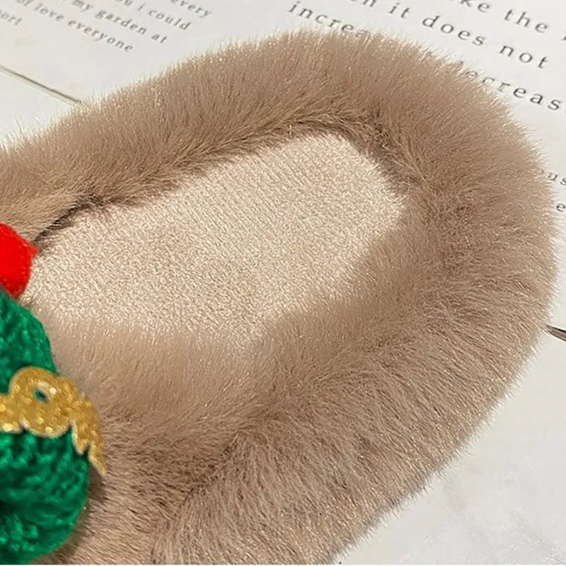 Women's Christmas hat decorated hairy faux plush slippers with rubber sole.