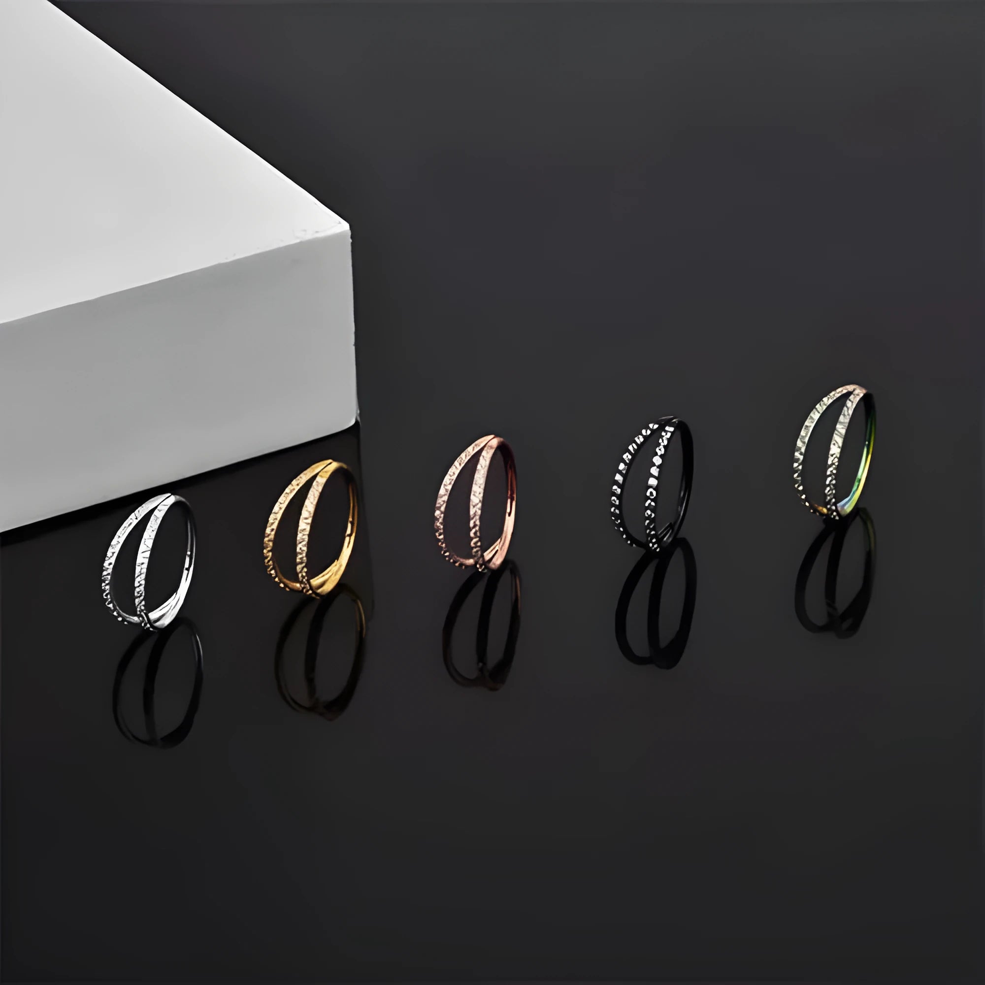 G23 titanium alloy lip and nose ring piercing jewellery in gold or steel colour, showing puncture-style design.