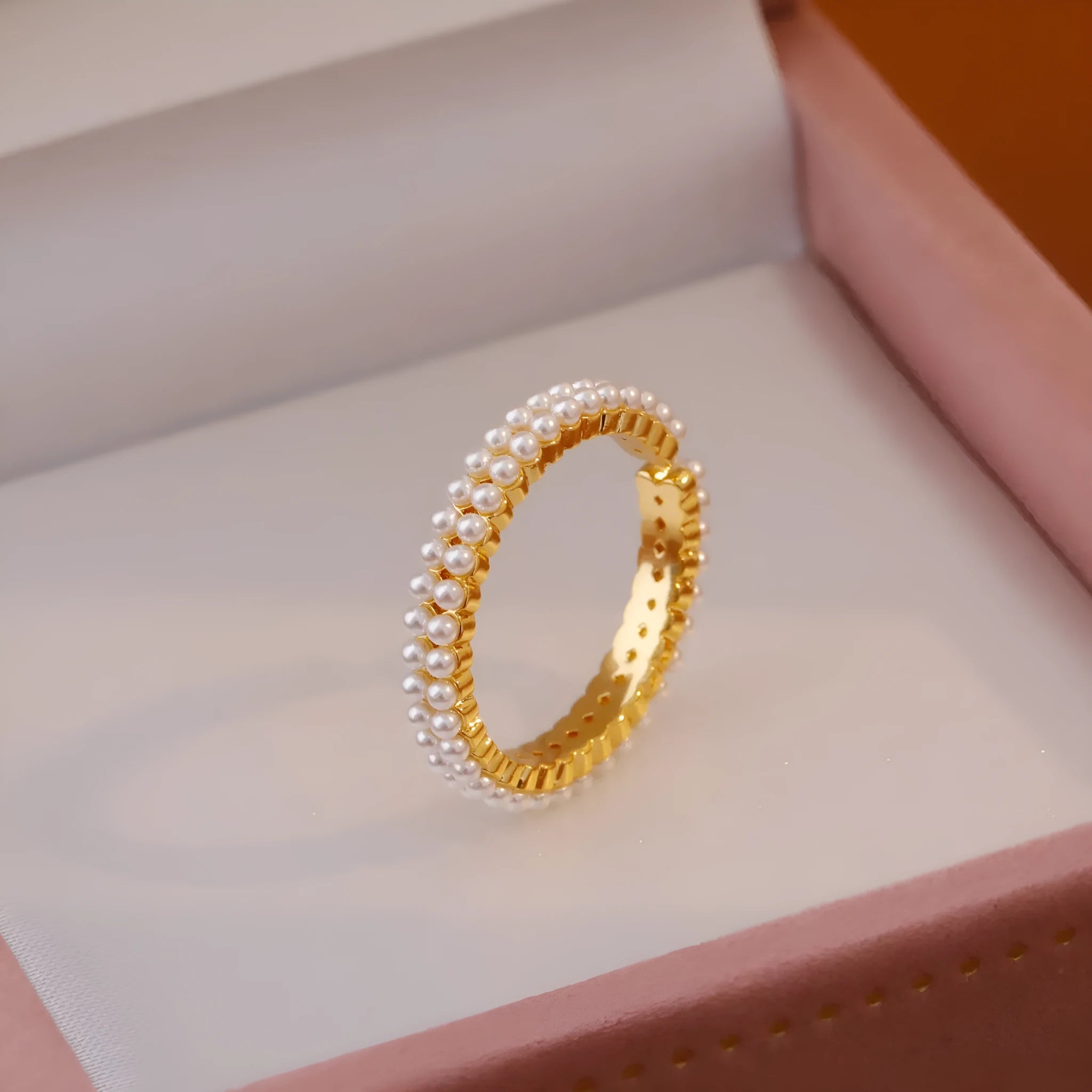 Gold geometric open mouth women's ring with round pearl-like elements on copper base