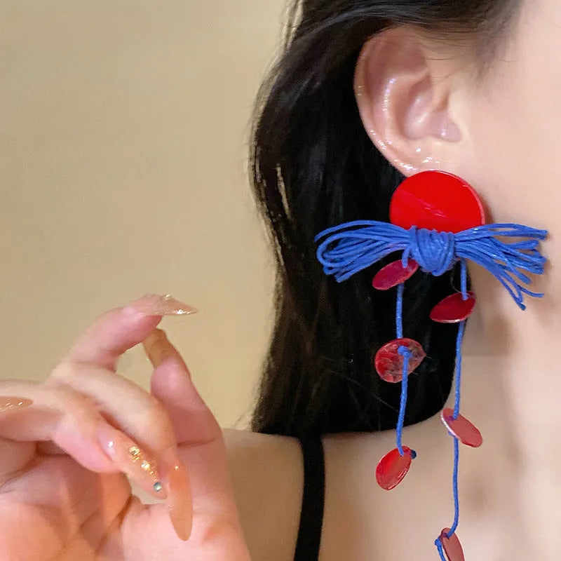 Geometric women's earrings with cloth construction and silver needle-blue resin flower accents