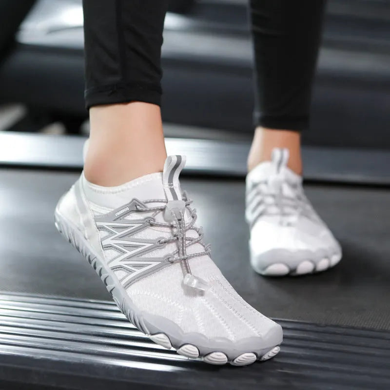 Lightweight low-top indoor fitness training sneakers in various colours with a non-slip rubber sole.