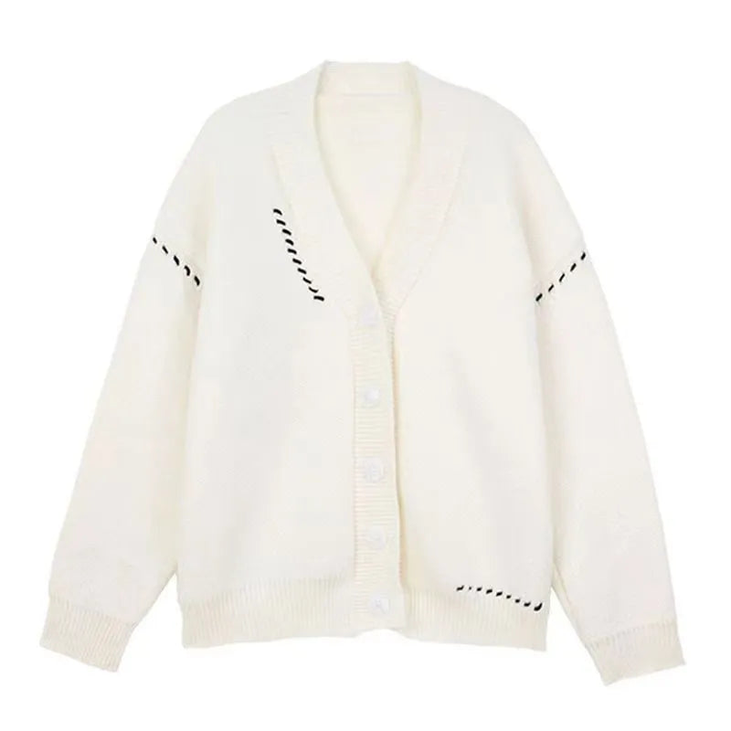 Women's loose fit knitted cardigan coat in black or white polyester with long sleeves