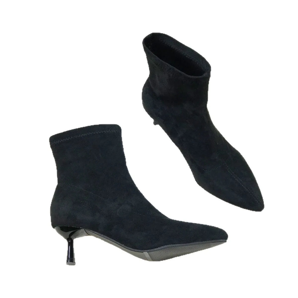 Black pointed toe women's ankle boots with a stiletto heel on a plain background.