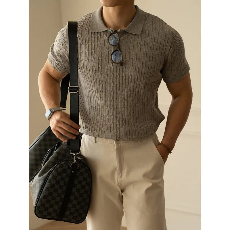 Men's khaki short sleeve business top on a hanger.