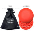 Orange natural rubber golf strength training mat with weighted centre section for swing practice