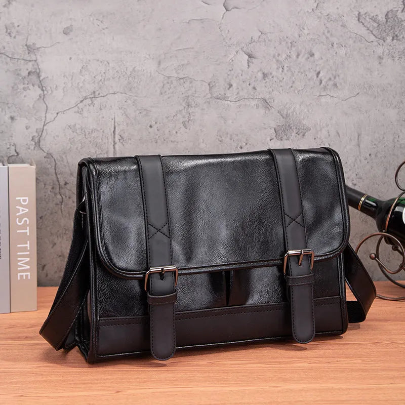 Black polyurethane commuter backpack with contrast stitching and anti-theft features