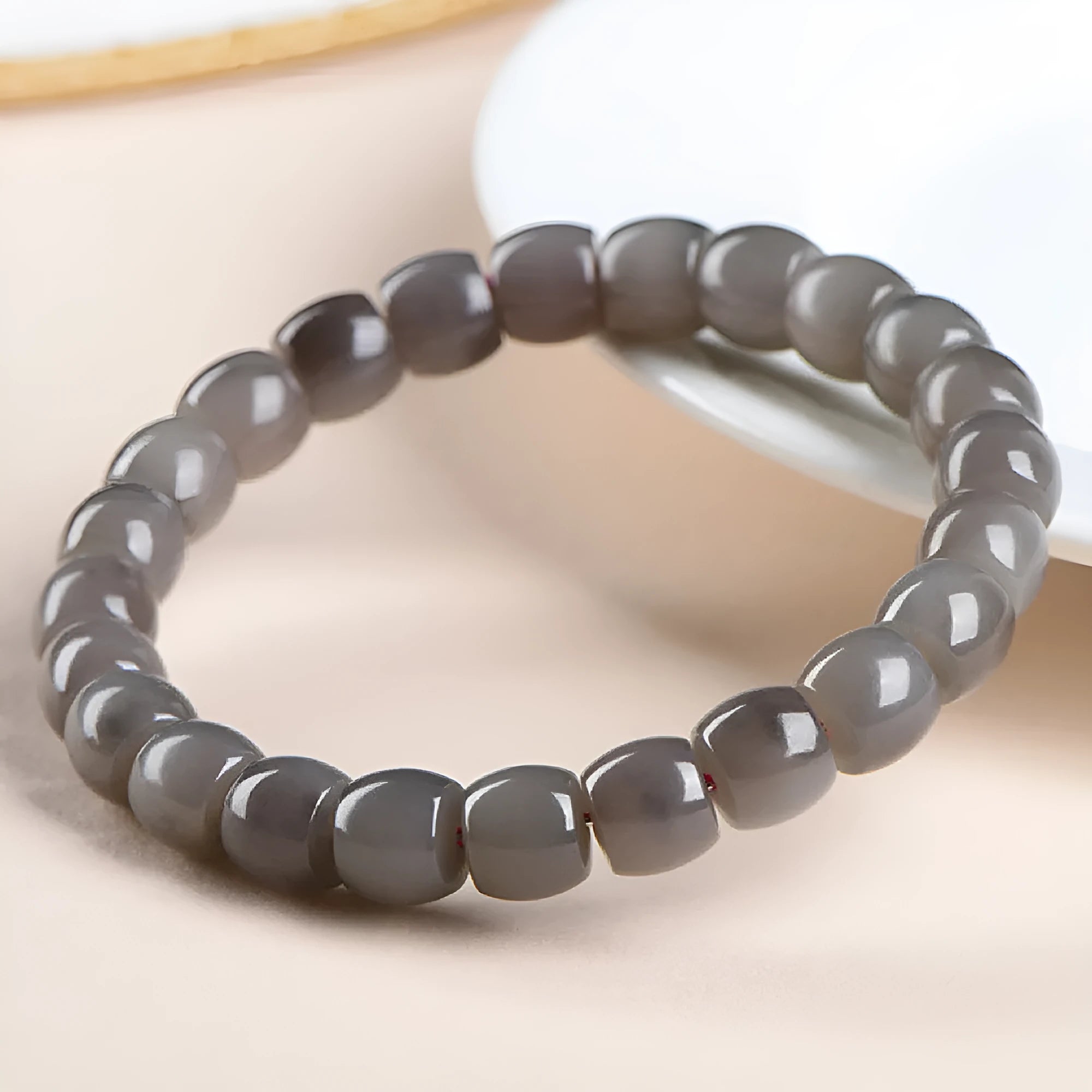 Straight cut Hetian jade bracelet in smokey violet colour with approximately 24 beads sized 8x9mm.