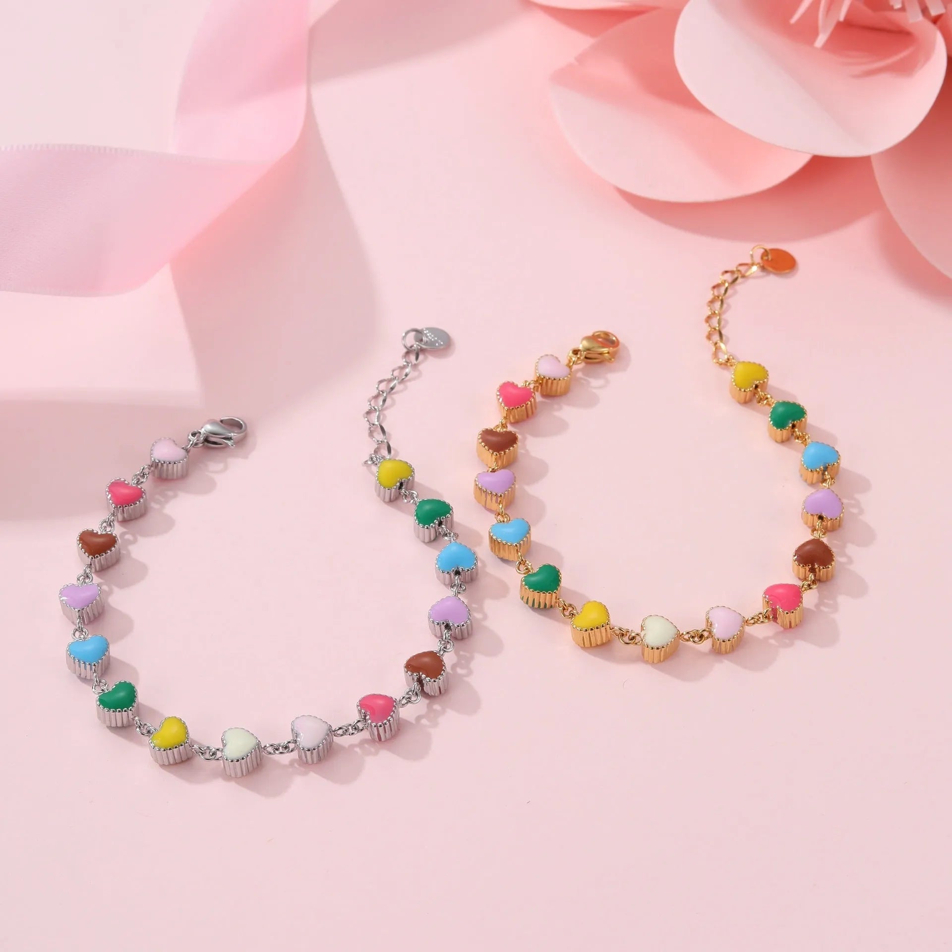 Women's stainless steel bracelet with love heart pendant in gold or steel finish