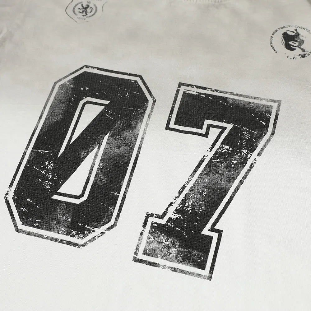 Men's black and white pure cotton short-sleeve printed t-shirt on a hanger.