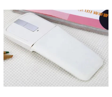 Folding Bluetooth wireless mouse shown in black, demonstrating its compact 131.2mm length and touch surface.