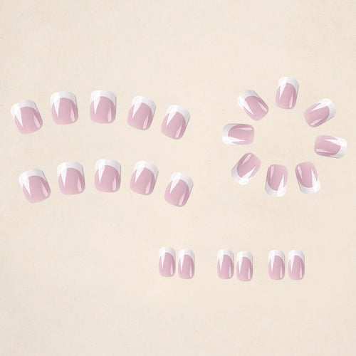 24 white plaid patterned press-on nail tips arranged in a box
