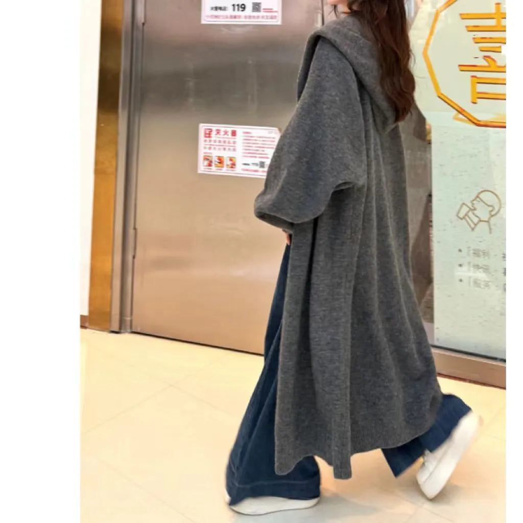Women's long knitted cardigan with hood in oatmeal colour, below knee length, loose fit