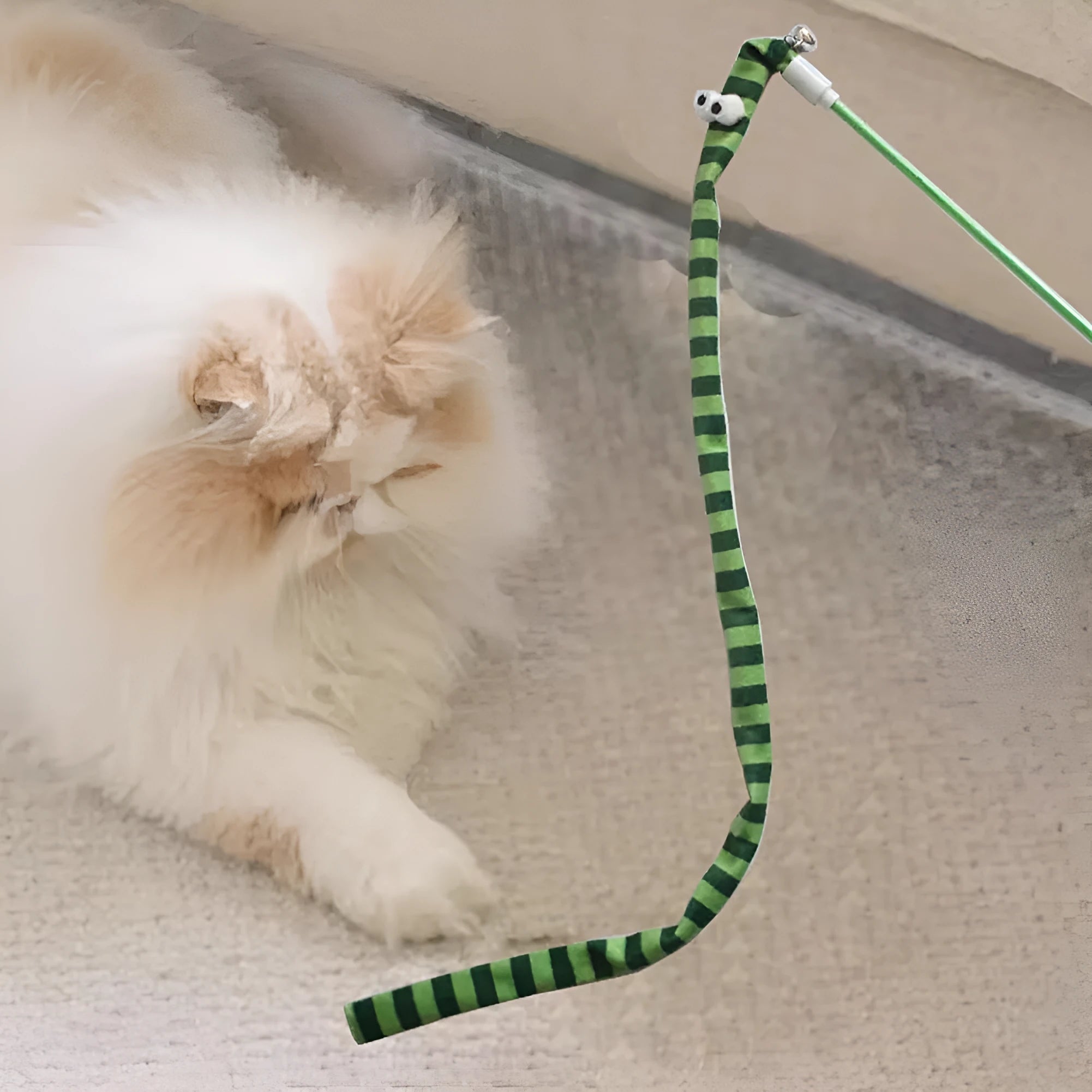 Cat teaser wand with colourful plush strip and bell on a polycarbonate pole.