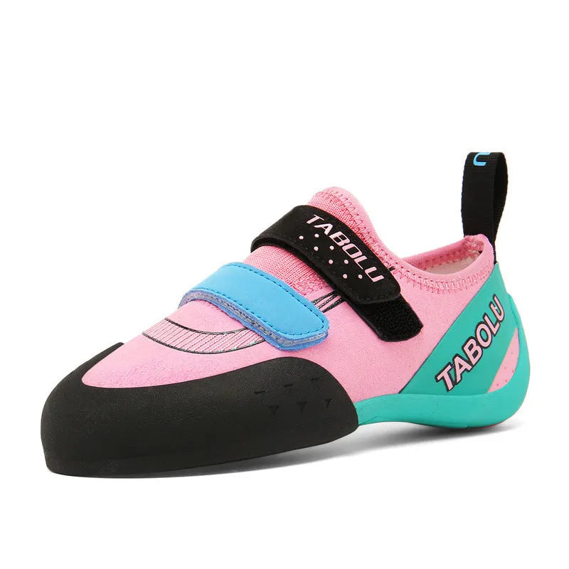 Beginner rock climbing shoes with Velcro strap and wear-resistant rubber sole in black and red colour.