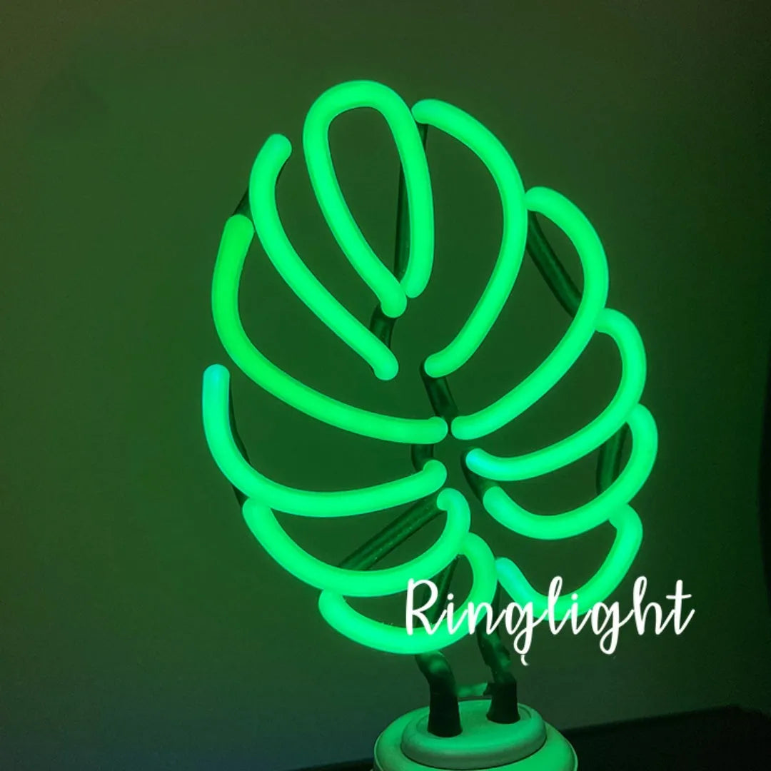 White bamboo-shaped desk lamp with green light, showing large and small size options.