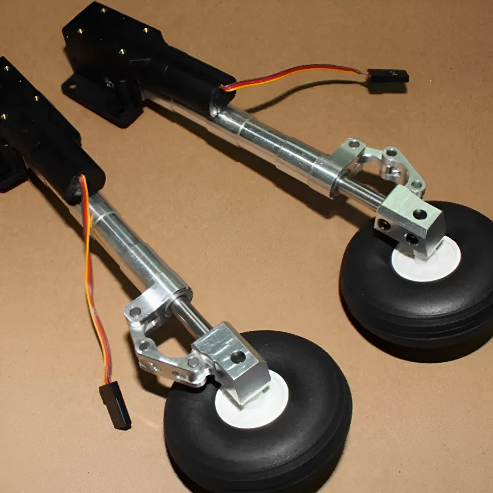 Retractable alloy landing gear for electric toy aircraft with shock absorption and multiple wheel size options