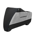 Polyester motorcycle cover in black colour shown covering a parked motorcycle for weather protection