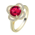 Copper fruit-shaped ring with a zircon stone inlay on a hand.