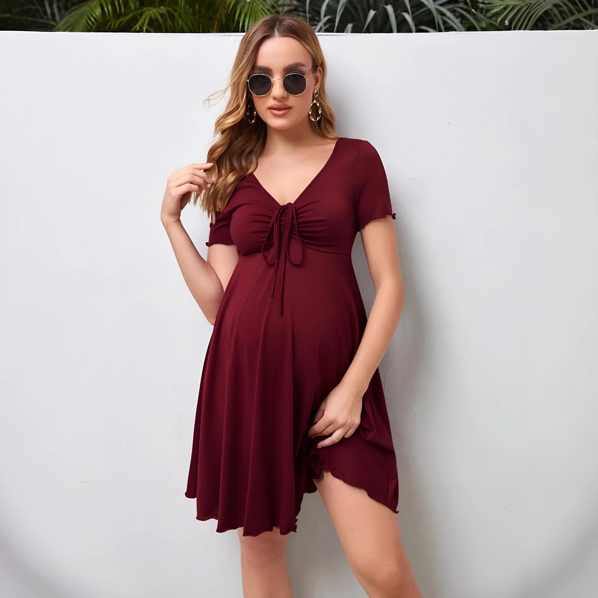 V-neck short-sleeved dress with lace-up drawstring at chest in dark red polyester, A-line skirt, quarter sleeves