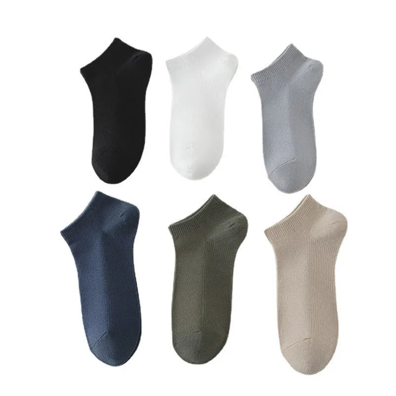 Pair of solid colour low-cut boat socks for men made from breathable polyester.