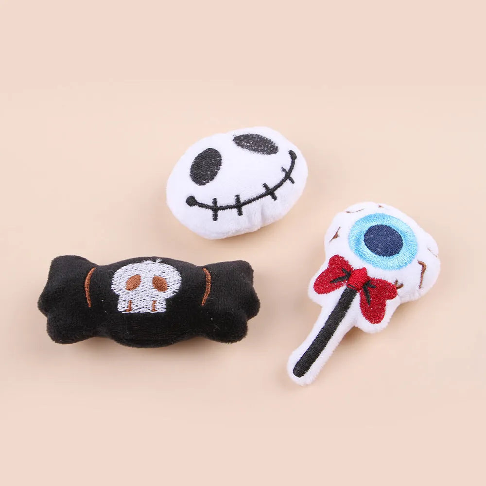 Small plush cat teaser wand with colourful eyes candy skull designs and feathers