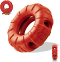 Blue beef-flavoured rubber tyre dog chew toy with oval openings for slow feeding.