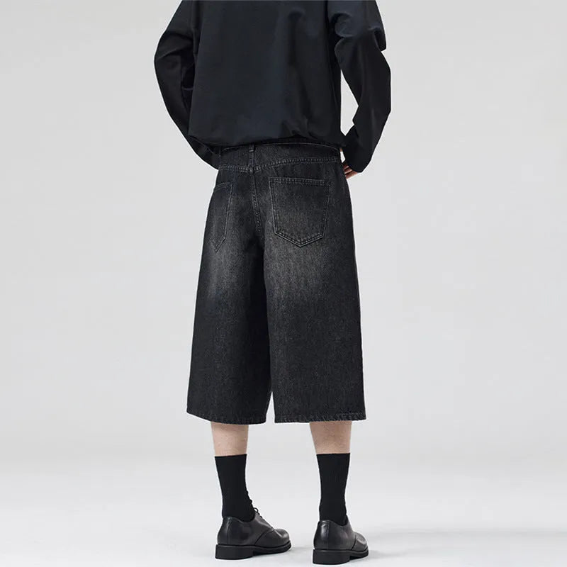 Men's light blue denim shorts with a straight-leg, cropped cut on a casual background.