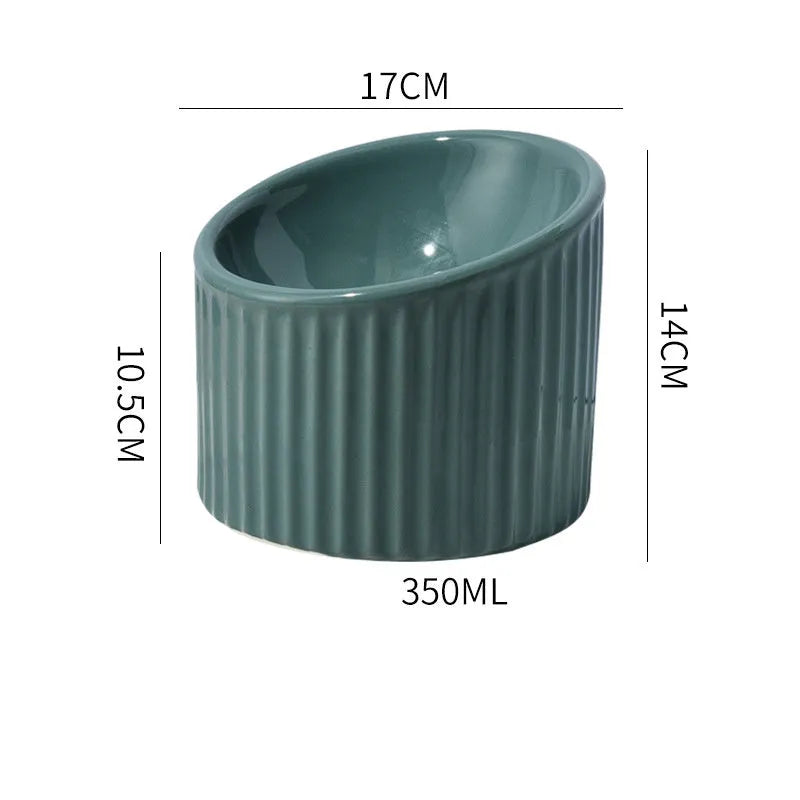 Ceramic elevated cat bowl in green or yellow with a tilted, round, whisker-friendly design.