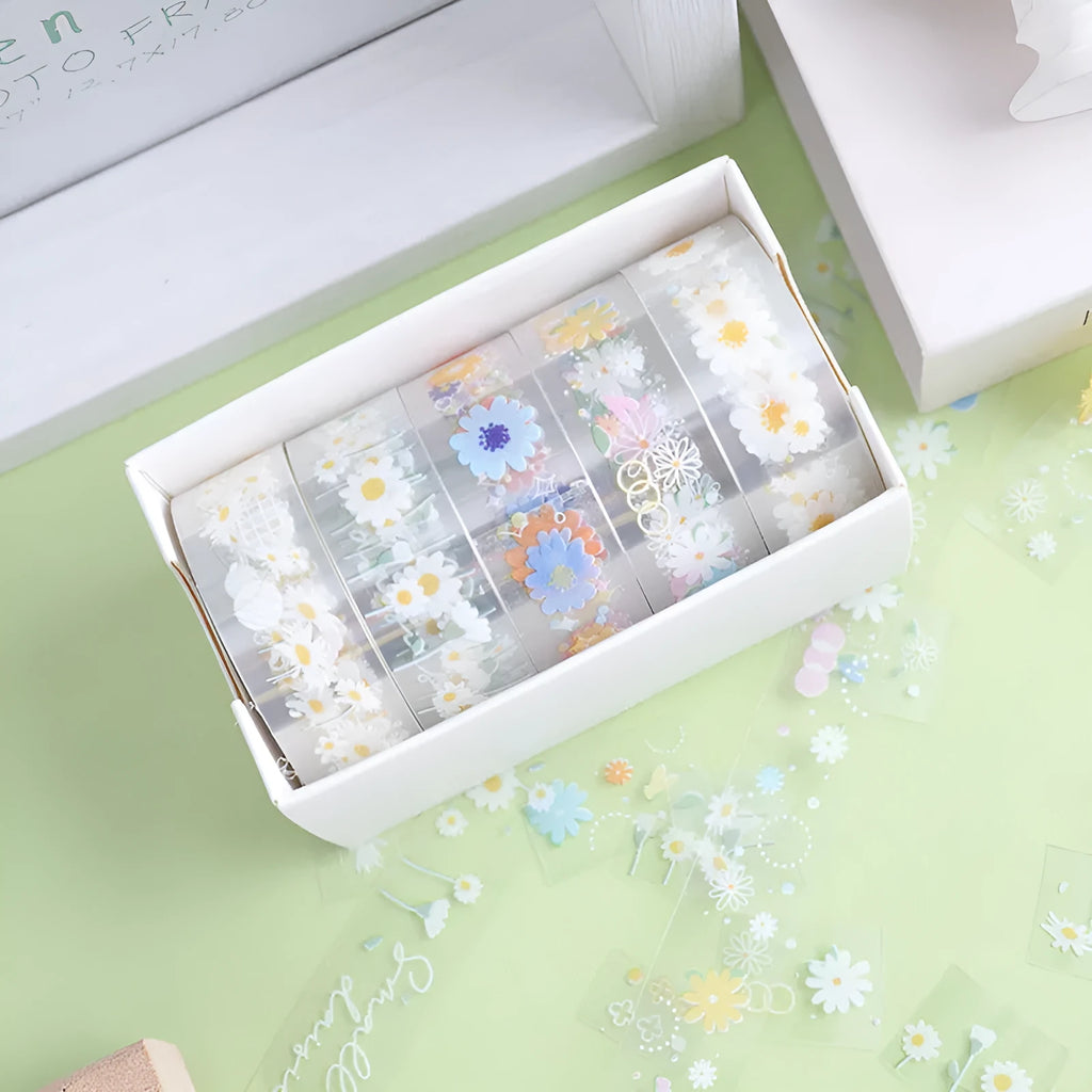 Five rolls of transparent adhesive tape with colourful daisy decoration on clear PET polyester backing