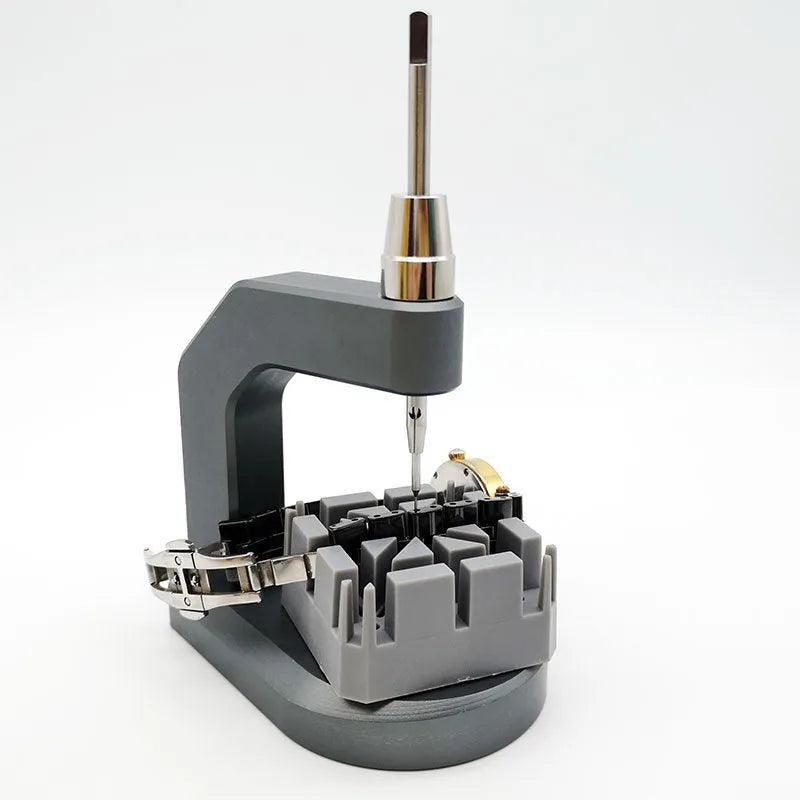 Silver tool steel multi-purpose press strap removal tool with 0.50-1.60mm blade on a workshop surface.