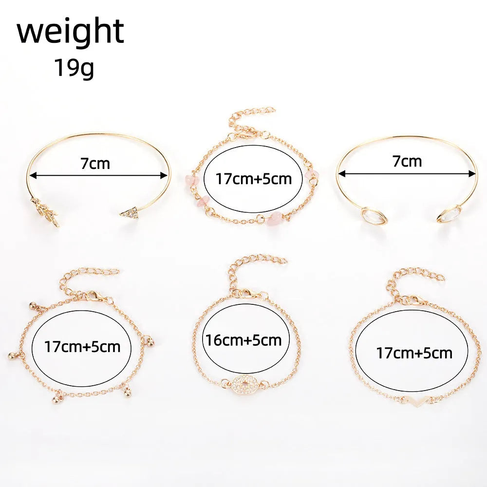 Gold zinc alloy women's bracelet set with arrow, water drop, and V-shaped pendants