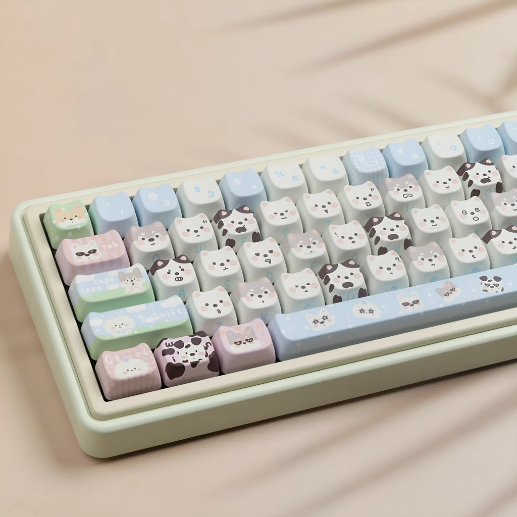 PBT sublimation key cap set showing colourful puppy and cat artwork on mechanical keyboard keys