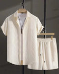 Man wearing a beige jacquard short sleeve suit jacket with matching shorts