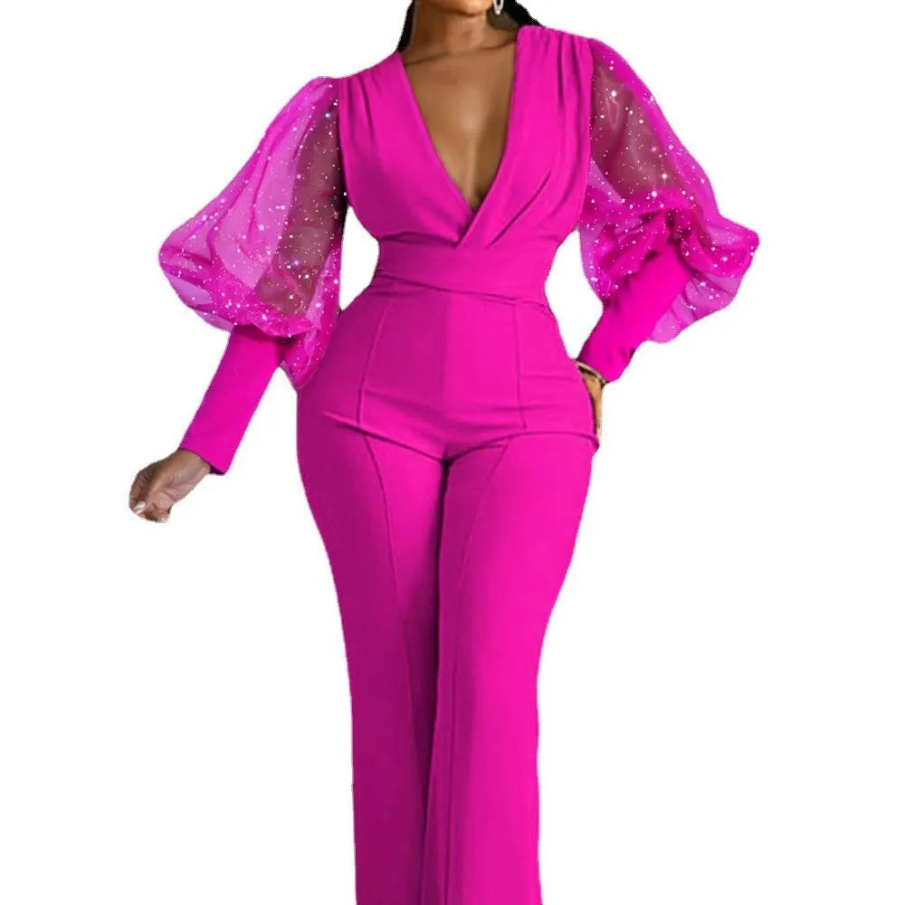Red women's jumpsuit with mesh stitching on long sleeves, slim waist, and wide-leg trousers