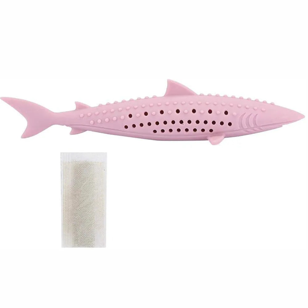 Green silicone dolphin-shaped cat chew toy on a white background, showing side air holes.