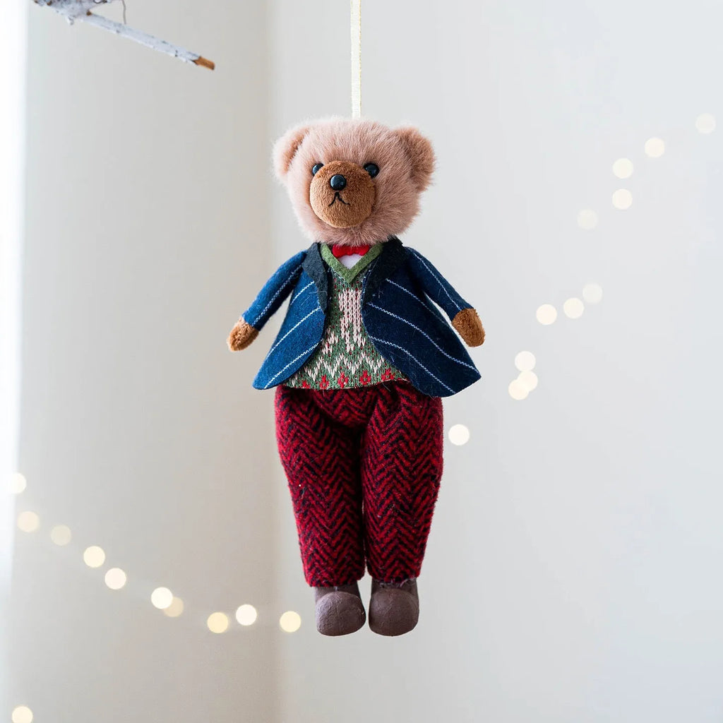 Cartoon plush bear doll wearing a cotton suit with a plaid print, in two colour options.